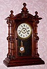  C.1875, E. N. Welch, Forestville, Conn, "PATTI, V.P." , 8-day time and strike mantel clock in rosewood with sandwich glass pendulum. 