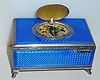  C.1940, Swiss, Singing Bird Box, guilloche enamel [blue] over patterned silver base. 