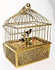  C.1965, Swiss, Singing Bird in Mini Cage, bottom wind, slide actuate, in a brass and filigree case. 