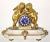  C.1860, Ormolu and white marble mantel clock, figures of an infant holding hands with a putti, Cupid, come to console him, both looking loving and pensive at the same time, the clock with a superior cobalt blue dial with gold stars and white numeral shields with black Roman numerals. 