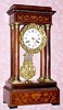  C.1880, French, Marti et Cie, 4-Column EMPIRE , style mantel clock, 8-day bell strike in a rosewood inlaid case. 