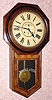  C.1906, Waterbury Clock Co., Waterbury, Conn, CONSORT, 8-day time and strike long drop octagon school clock in walnut. 