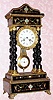  C.1880, French, 4-column Empire style ebonized clock with pressed brass trim and feet, and inlay of brass and MOP, 8-day time and bell strike.