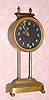  C.l921, English Gravity timepiece 30-hour movement is driven by its own weight to be raised each day along a tooth upright, with a visible escapement and a compound bar-bell pendulum. 