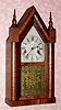  C.1860, Ansonia Brass Co., Ansonia, Conn, SHARP GOTHIC, or steeple clock, 30 hour time and strike in a striped mahogany case. 