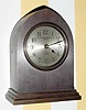  C.1925 Chelsea Clock Co., Boston. Mass., "Gothic", 8-day desk timepiece with the serial no. 169240 retailed by Bigelow, Kennard and Co., Inc., Boston in a polished bronze or red brass case.