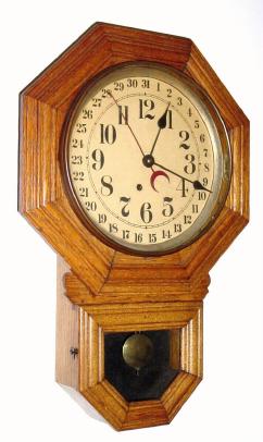 C.1915, E. Ingraham and Co., Bristol., Conn., "Ingot", oak short drop octagon model with calendar, 8-day timepiece. — Antique Clocks Price Guide