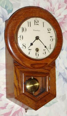 C.1930, Waterbury Clock Co., "6 Inch Drop" 8-day schoolhouse style oak timepiece. This also looks like the Daintie No. 1 model. — Antique Clocks Price Guide