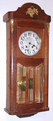 C.1915, French, 8-day time and rod strike oak cased wall clock, with heavy beveled glass in the door and ormolu trim. — Antique Clocks Price Guide