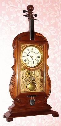 C.1975, Modern Repro of the famous VIOLIN clock. The originals were made by Seth Thomas in the 1890s, see one in Palmer's TREASURY OF AMERICAN CLOCKS, PAGE 259. — Antique Clocks Price Guide