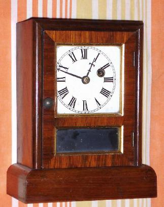 C.1881, Seth Thomas Clock Co., "Cottage R", 30-hour rosewood cottage timepiece. — Antique Clocks Price Guide