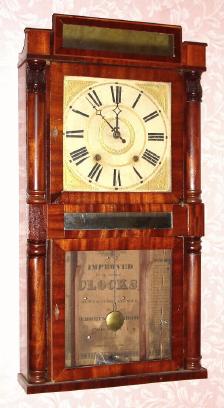 C.1830, Jeromes and Darrow, Bristol, Conn., 30-hour time/strike wood movement, two deck, half column and splat shelf clock, pineapple capitals on top columns. — Antique Clocks Price Guide