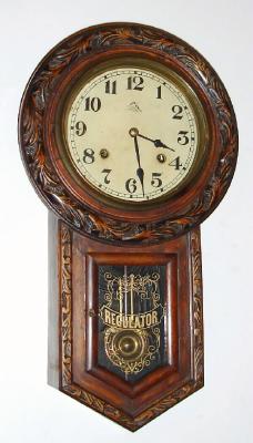 C.1910, Japanese, 8-day time and gong strike short drop school clock. Japanese made clock with a label marked "Nardin" to appear European, also with flying dial trademark that is German. — Antique Clocks Price Guide