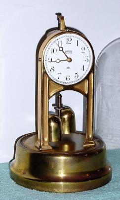 C.1929, Tiffany Never-Wind, Buffalo, NY, MODEL 1100, 4.5v battery energized timepiece with original glass dome — Antique Clocks Price Guide