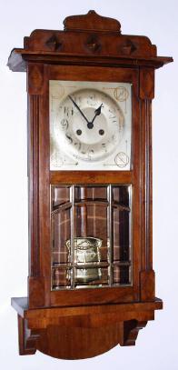 C.1900, German, F. Mauthe, 8-day time and bim bam [rod strike] art nouveau style wall clock in walnut with 9 panes of heavy beveled glass in a brass frame. — Antique Clocks Price Guide