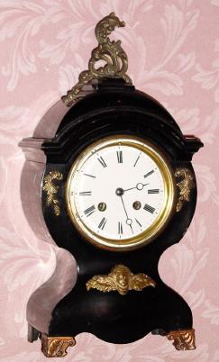 C.1900, Mixed lot: Japy Freres and Cie, good French bell strike movement, now in an American enameled iron case with metal ornaments. — Antique Clocks Price Guide