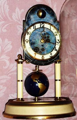 C.1954, German, J. Kaiser "UNIVERSE", 400-Day clock with unique compound pendulum with rotating terrestrial globe. — Antique Clocks Price Guide