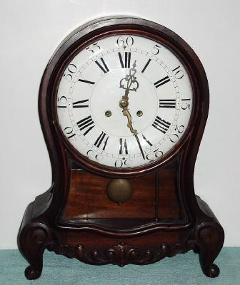 C.1900, German, Muller and Co., Muhlheim an Donau, mahogany mantel clock in the Swiss Neuchatel style, 8-day, quarter striking on double gong assembly, serial No. 16908. — Antique Clocks Price Guide
