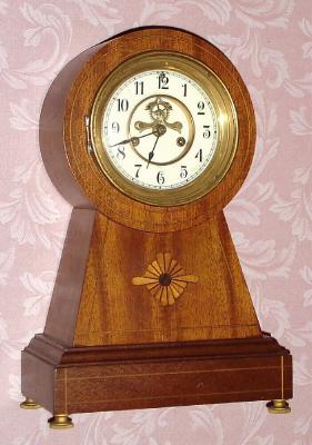 C.1913, Waterbury Clock Co., "Surrey", 8-Day mahogany mantle clock, keyhole style case, with inlay and open escapement on the dial. — Antique Clocks Price Guide