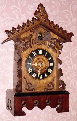 C.1910, German, Shelf Cuckoo, classic German style with rail of leaves on top, 8-day. — Antique Clocks Price Guide