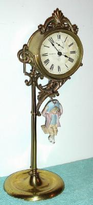 C.1895, Ansonia Clock Co., JUMPER No.1, one day novelty timepiece, original brass finish, with old doll. — Antique Clocks Price Guide
