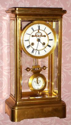C.1900, French, for Tiffany and Co., Giant Brass and Glass mantel regulator. Both the movement and dial are signed Tiffany and Co. — Antique Clocks Price Guide