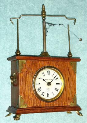 C.1885, Jerome and Co., (New Haven Clock Co.). "Flying Pendulum No. 1" novelty timepiecein oak. Also known as "Ignatz" clock. — Antique Clocks Price Guide