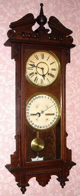 C.1908, Waterbury Clock Co., "Calendar No. 33", 8-day time/strike calendar wall clock. — Antique Clocks Price Guide
