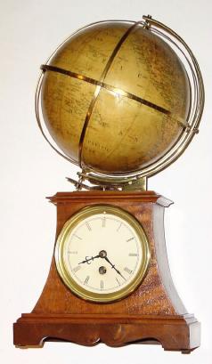 C.1900, German for the English Market, Terrestrial Globe, World Time Clock, 30-hour, all drawings/ indications in English. — Antique Clocks Price Guide