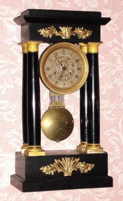 C.1850, French, 4-Column Empire style mantel clock, 8-day bell strike with grid pendulum. — Antique Clocks Price Guide
