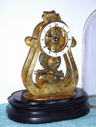 C.1900, French, Skeleton alarm-Timepiece, 8-day, engraved front plate with porcelain dial. — Antique Clocks Price Guide