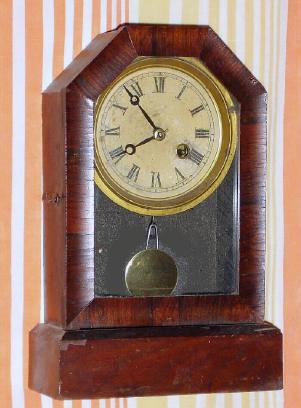 C.1875, Terry Clock Co., Waterbury, Conn., 30-hour rosewood cottage timepiece. — Antique Clocks Price Guide