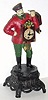 C.1955, German version of a Russian Clock Peddler, cast white metal make figure with cap and goatee, holding 3 clocks, the front clock with spring driven pendulette movement, 30 hour. 