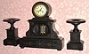 C.1890, French, 8-day time/strike 3-piece black marble garniture set. 