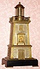 C.1880, French, Guilmet, Paris, Industrial Series "Lighthouse" Automaton shelf clock, gong striking movement with Brocot escapement, the helical spring /torsion balance forming the animated "light" of the tapered brickwork case, serial No. 1019. 