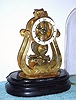 C.1900, French, Skeleton alarm-Timepiece, 8-day, engraved front plate with porcelain dial. 
