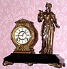 C.1890, F. Kroeber, New York, CALIFORNIA, Cast metal figural clock, 8-day time and gong strike. 