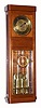 C.1910, German, Gustav Becker, 3-Wt Grand Sonnerie, wall clock in a Deco styled walnut case with a decorative panel with 8 panes of heavy beveled glass. 