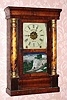 C.1860, New Haven Clock Co., 8-day time and gong strike miniature column and cornice shelf clock.This clock was exported to England and ended up in Dublin (on dial and repair label inside). 