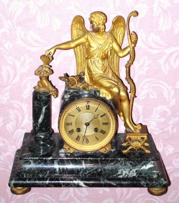 C.1890, French, Marble and Gilt bronze figural mantel clock, Victorious Archer,  that was retailed by A. Stowell and Co., Boston. — Antique Clocks Price Guide