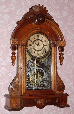 C.1878, F. Kroeber Clock Co., "Powhatan", 8-day time and strike walnut parlor clock. This model was also named the "Floretta" after 1880. — Antique Clocks Price Guide