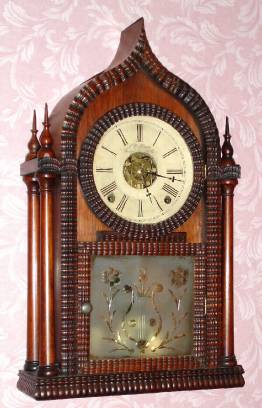 C.1848, Forestville Mfg, J. C. Brown, Rounded Gothic, or Onion top, in a rosewood, full ripple case, 8-day, T/S/Alarm. — Antique Clocks Price Guide