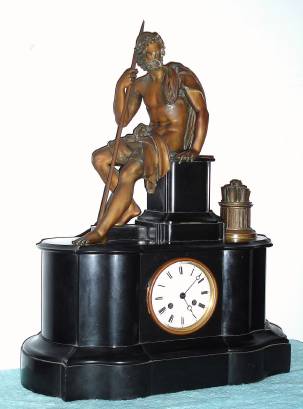 C.1890, French, Black Slate Figural clock, 8-day time and bell strike, with a patinated spelter statue of a seated and bare foot centurion with a container of papyrus records to his left. — Antique Clocks Price Guide