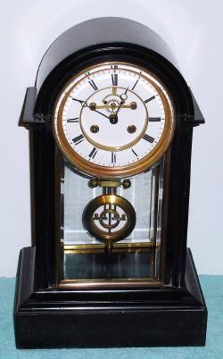 C.1890, French, Sam'l Marti, Mantel regulator, black slate with large movement, open escapement dial, and Ellicott style pendulum. — Antique Clocks Price Guide