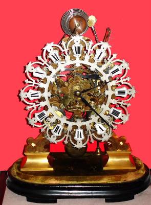 C.1870, English, Joseph Mayer, Lord St., Liverpool, (1803--1886) 3-Tr, 8-Bell Skeleton Clock in a heavy scroll frame, and a display case (original cracked dome included). — Antique Clocks Price Guide
