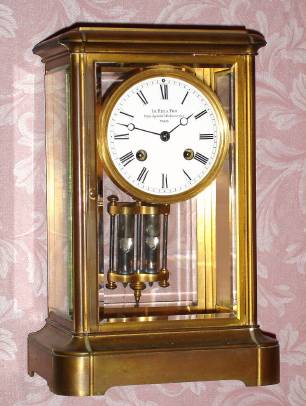 C.1900, French, LeRoy and Fils, Palais Royal, Paris, 8-day time and strike, 4-glass "crystal regulator" mantel clock, solid dial, in an extra heavy brass case with cast top and shaped base, serial No. 10183 (signed on dial and mov't). — Antique Clocks Price Guide