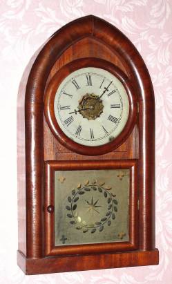 C.1910, Jerome and Co. (New Haven Clock Co.), 8-day Turner's Patent alarm beehive timepiece (for those who need a loud alarm). You usually find this alarm movement in steeple cases, so this is a bit uncommon; note alarm train takes the place of the strike train. — Antique Clocks Price Guide