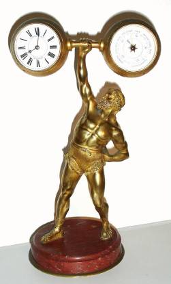 C.1895, French, Commemorative of EUGENE SANDOR, famous weight lifter who performed at the World Columbian Exposition in 1893, gilt bronze on a marble base, small 8-day platform style timepiece in left ball. — Antique Clocks Price Guide