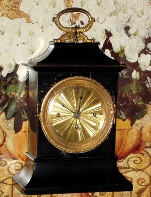C.1825, Austrian, Carriage Clock, Grand Sonnerie, an ebonized wooden case with carry handle and repeat button in handle base. — Antique Clocks Price Guide