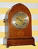 C.1900, German, Winterhalder and Hofmeier, lancet top, quarter striking bracket clock, with brass feet and side handles, silvered dial, 8-day. 